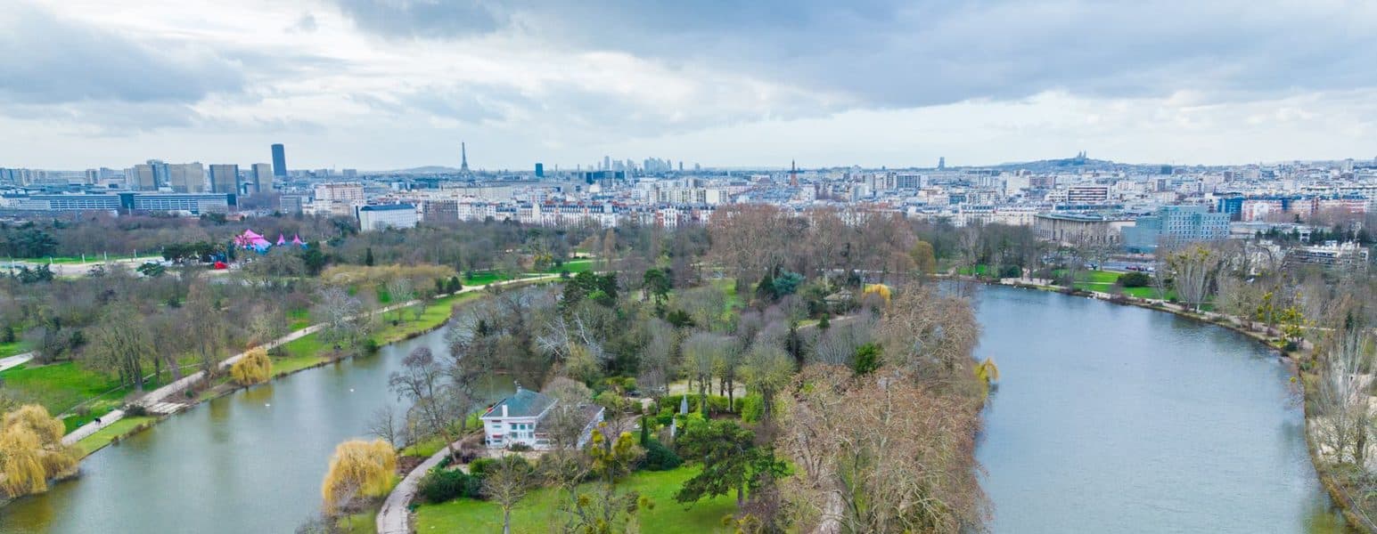 The lakes and wooded alleys of the Bois de Boulogne.